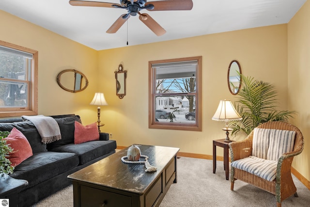 carpeted living room featuring ceiling fan