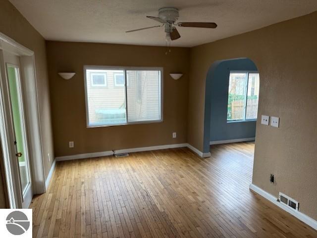 spare room with ceiling fan and light hardwood / wood-style floors