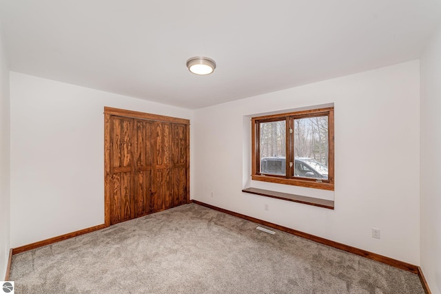 unfurnished bedroom with carpet flooring