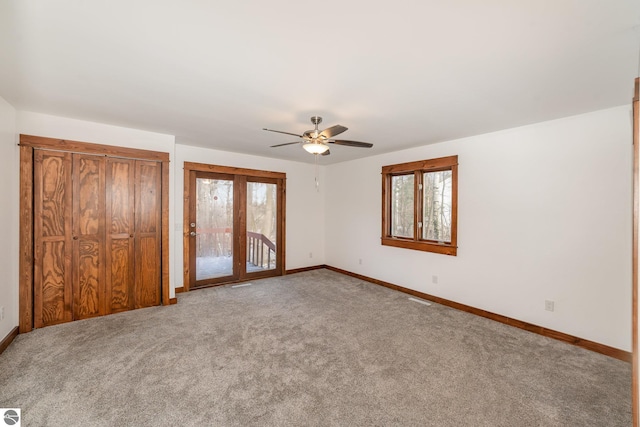 unfurnished bedroom with ceiling fan, access to exterior, and carpet floors