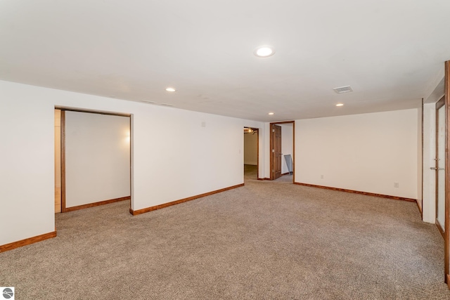 basement with light colored carpet