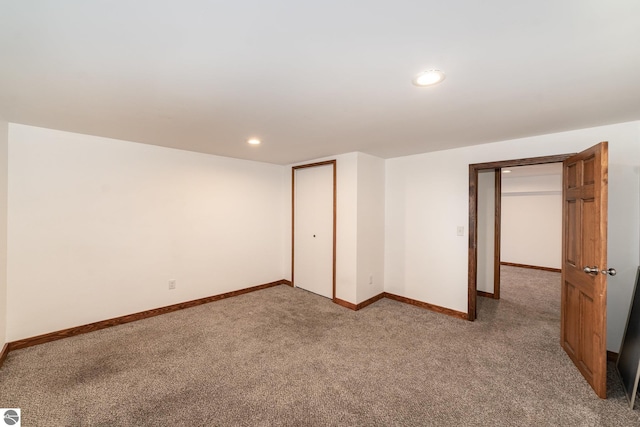 unfurnished bedroom with carpet floors and a closet