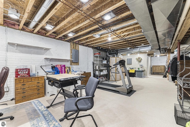 interior space featuring electric panel and brick wall