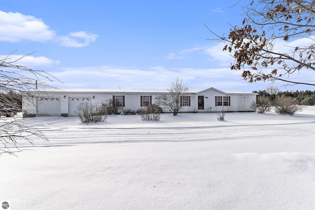 11249 SW Frankie Ln, Fife Lake, MI 49620 - view of front of property featuring a garage