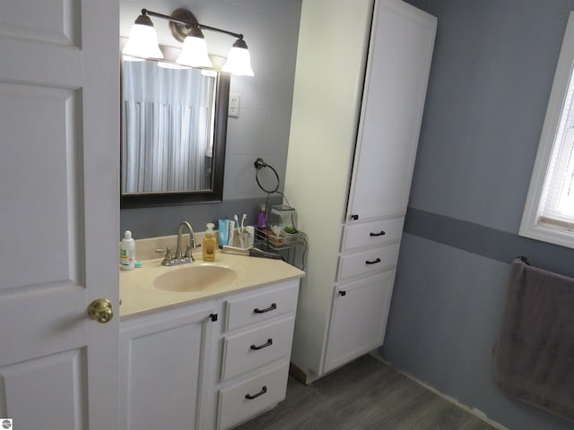 bathroom featuring vanity and wood-type flooring