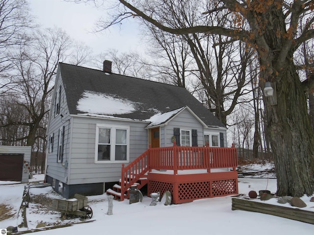 view of front of property with a wooden deck