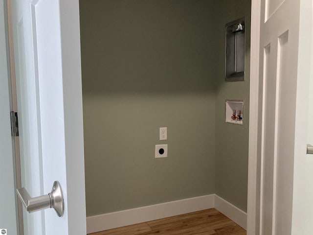 laundry room with hookup for an electric dryer, hookup for a washing machine, and wood-type flooring