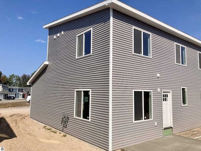 view of side of home featuring a patio