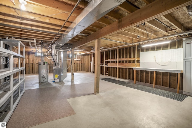 basement with gas water heater and heating unit