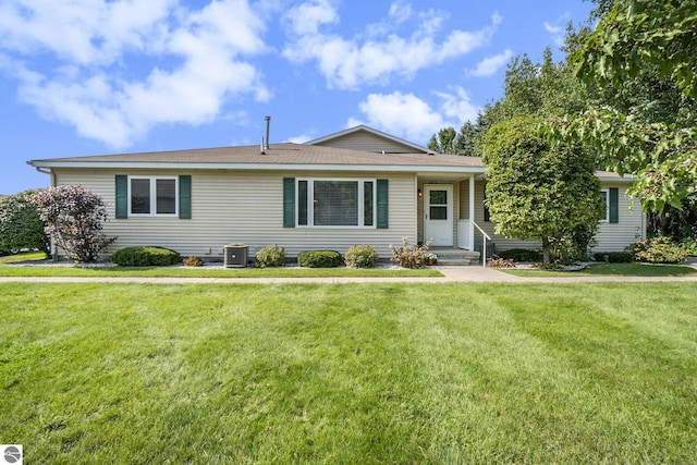 single story home with central AC unit and a front lawn