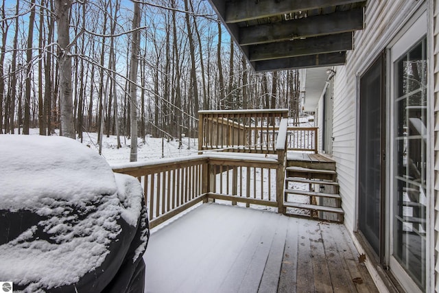 view of snow covered deck