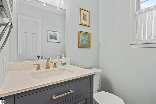 bathroom with vanity and toilet