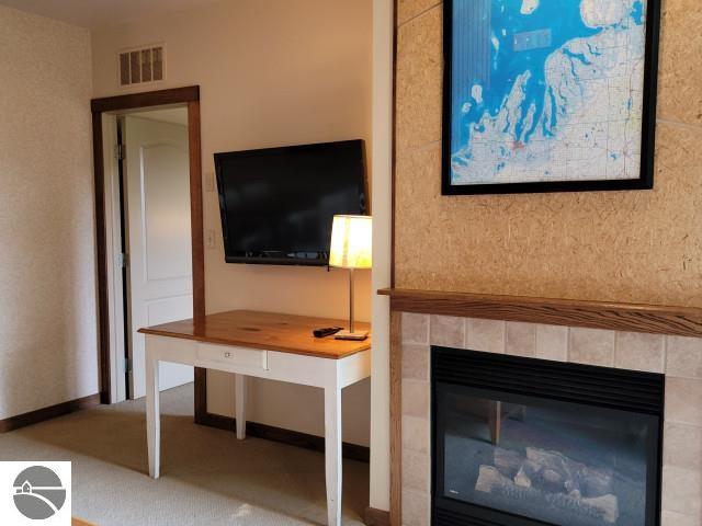 unfurnished living room featuring a fireplace