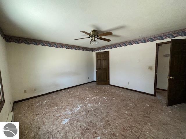 unfurnished bedroom featuring ceiling fan