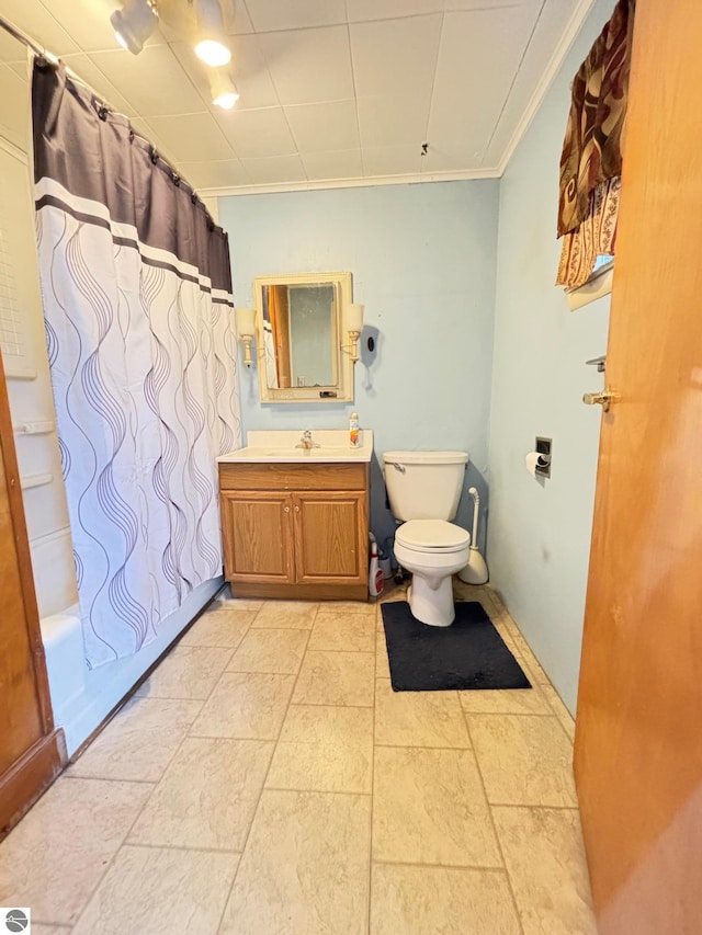 full bathroom with toilet, vanity, shower / bath combo, and ornamental molding