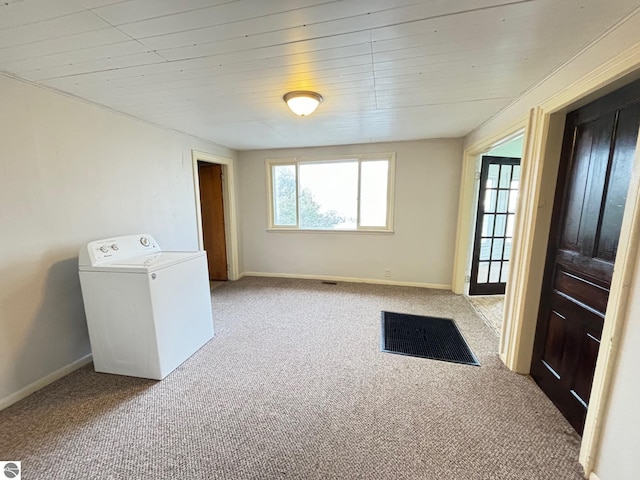 interior space featuring wood ceiling and washer / clothes dryer