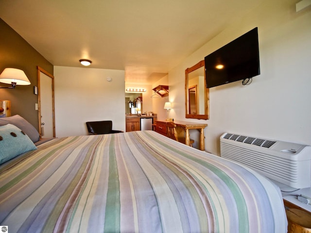 bedroom with an AC wall unit