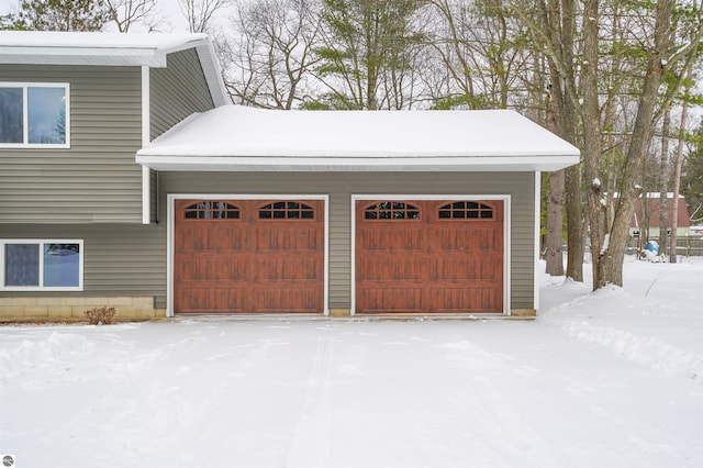 view of snow covered garage