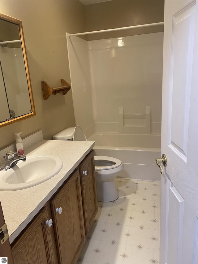 full bathroom with vanity, shower / bath combination, and toilet