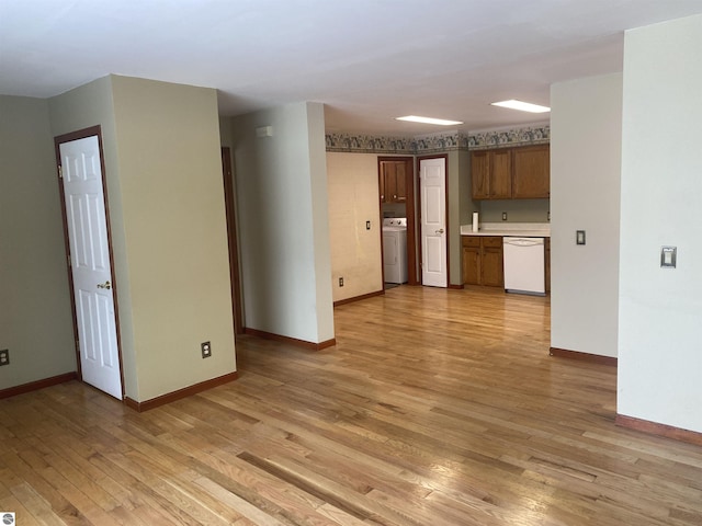 interior space with light wood-type flooring and washer / dryer