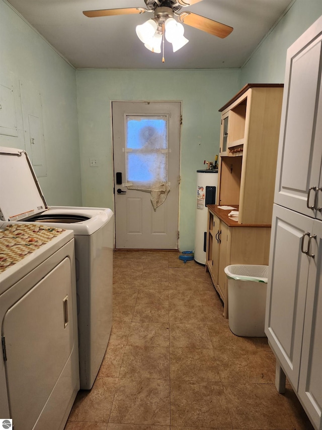 laundry room featuring ceiling fan, independent washer and dryer, cabinets, and electric water heater