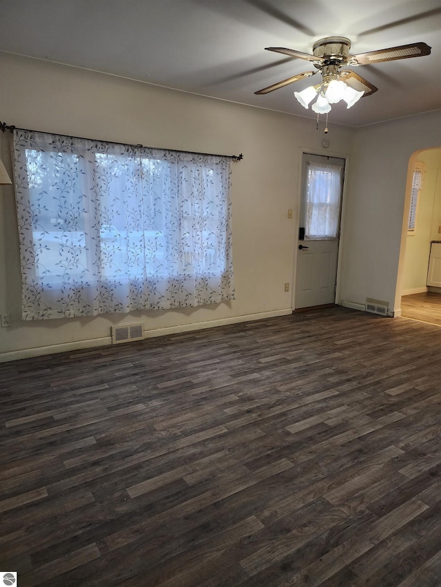 unfurnished room featuring ceiling fan and dark hardwood / wood-style floors