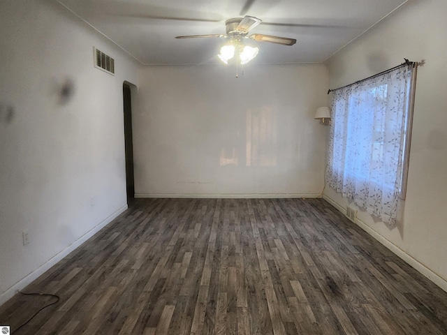 unfurnished room featuring ceiling fan and dark hardwood / wood-style flooring