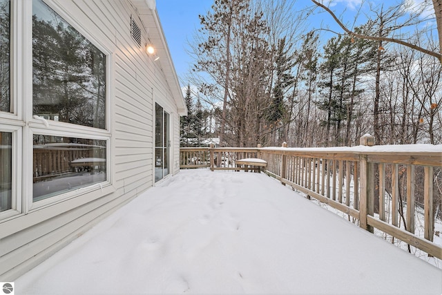 view of snow covered deck