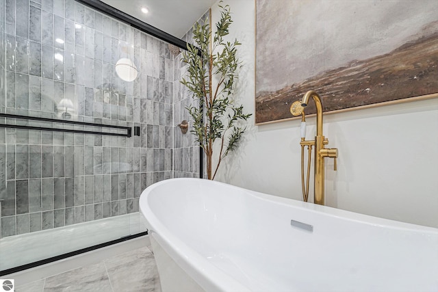 bathroom featuring a tub to relax in