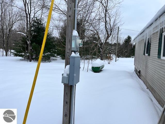 view of yard layered in snow