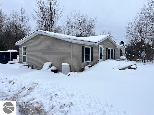 view of snow covered property