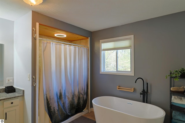 bathroom with vanity and independent shower and bath