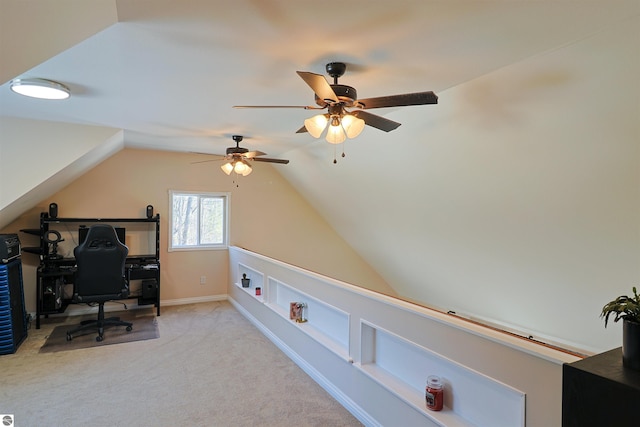 carpeted home office featuring ceiling fan and lofted ceiling