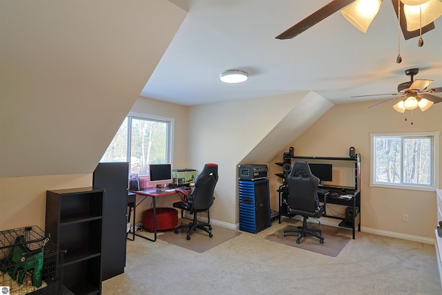 office area featuring light carpet, ceiling fan, and lofted ceiling