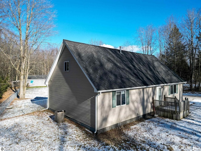 view of snowy exterior with central AC