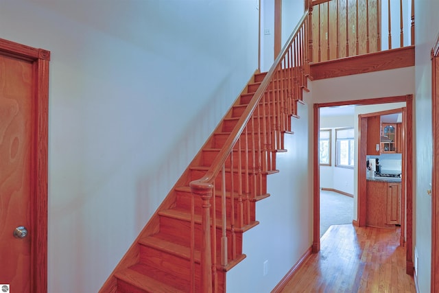 stairway featuring hardwood / wood-style flooring