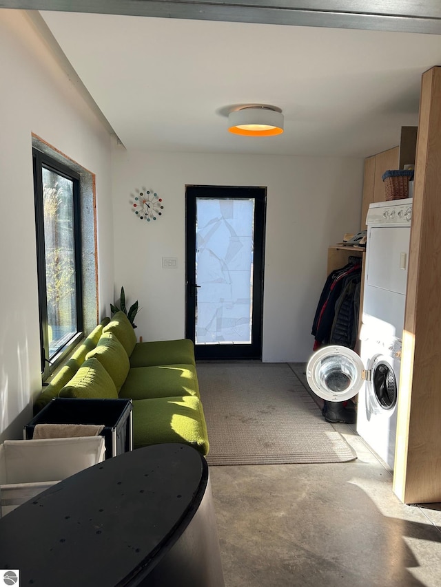 laundry room featuring stacked washer / dryer