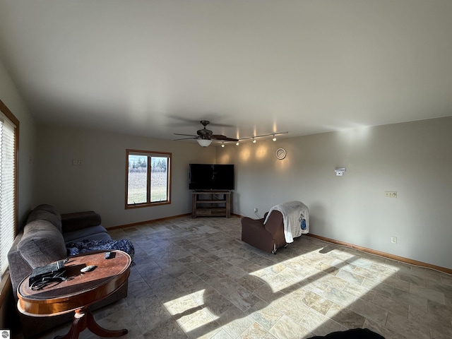 living room with rail lighting and ceiling fan