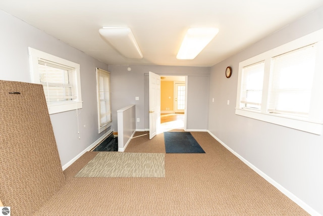 hallway with carpet flooring