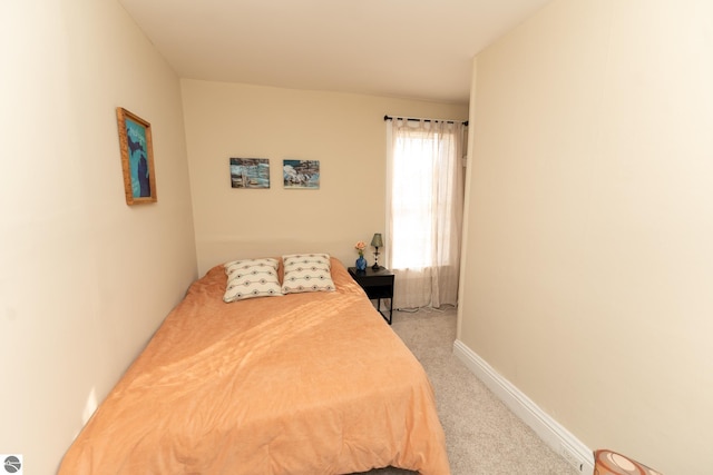 bedroom with light colored carpet