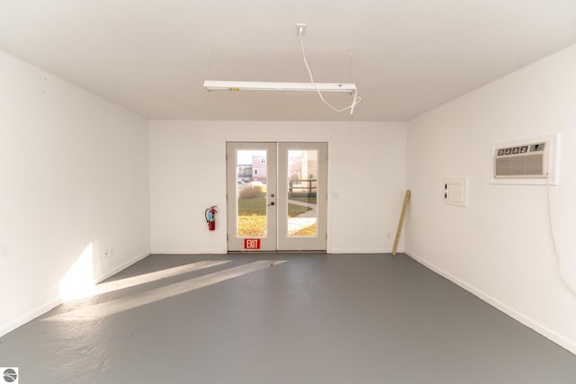 garage featuring a wall unit AC