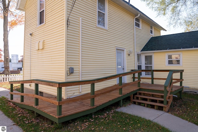 rear view of house featuring a deck