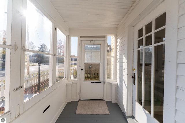 unfurnished sunroom featuring plenty of natural light