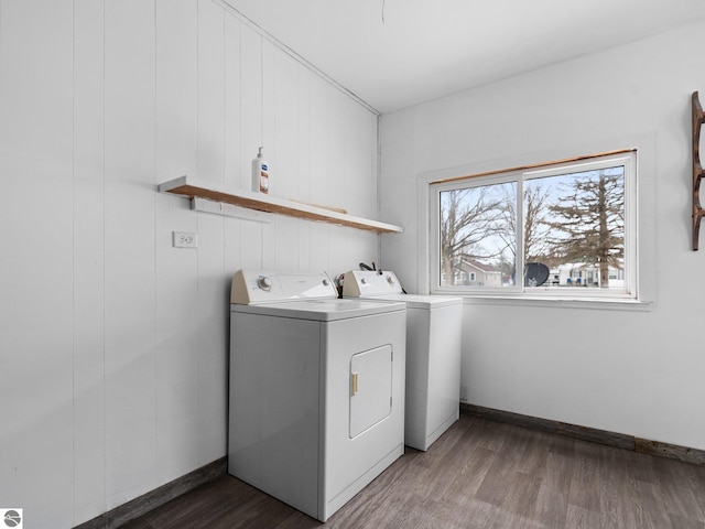 washroom with washer and dryer and dark hardwood / wood-style floors