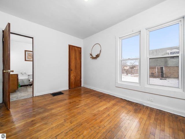 unfurnished bedroom featuring hardwood / wood-style floors