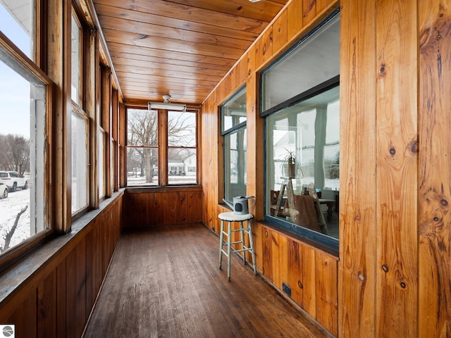 unfurnished sunroom featuring wood ceiling