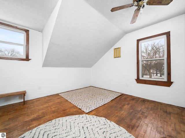 bonus room featuring hardwood / wood-style floors, ceiling fan, and lofted ceiling