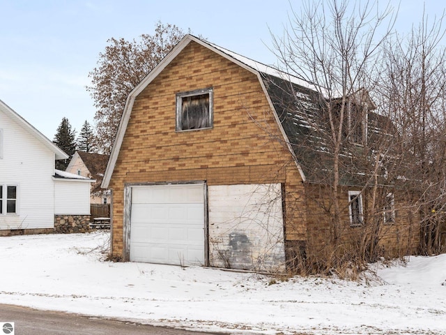 view of snow covered garage