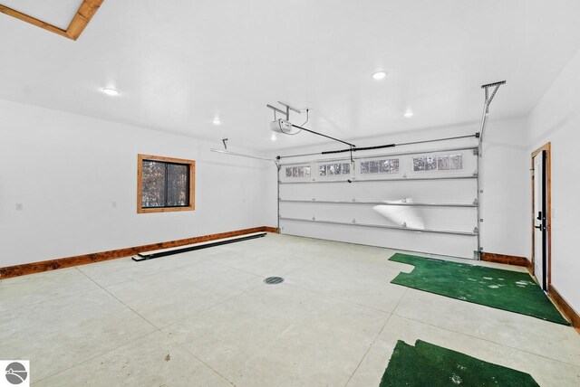 108 Rolling Oak Ln, Roscommon, MI 48653 - garage with recessed lighting, baseboards, and a garage door opener