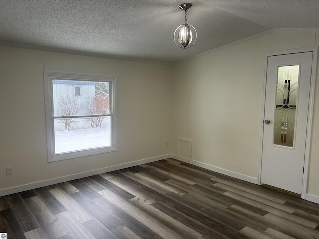 unfurnished room with a textured ceiling, dark hardwood / wood-style flooring, lofted ceiling, and a notable chandelier